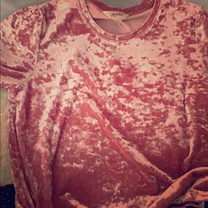A pink velvet cropped top.